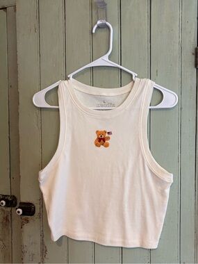 Goodie Two Sleeves Cream Teddy Flag Cropped Tank